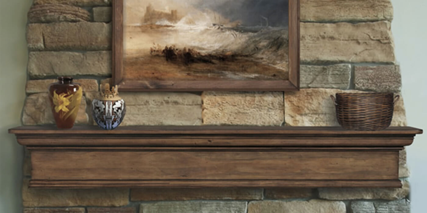 A wooden fireplace mantel from the brand Pearl Mantels