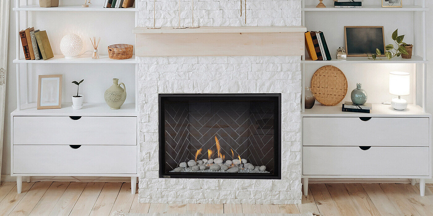 A custom feature wall with a gas fireplace and built-in shelving
