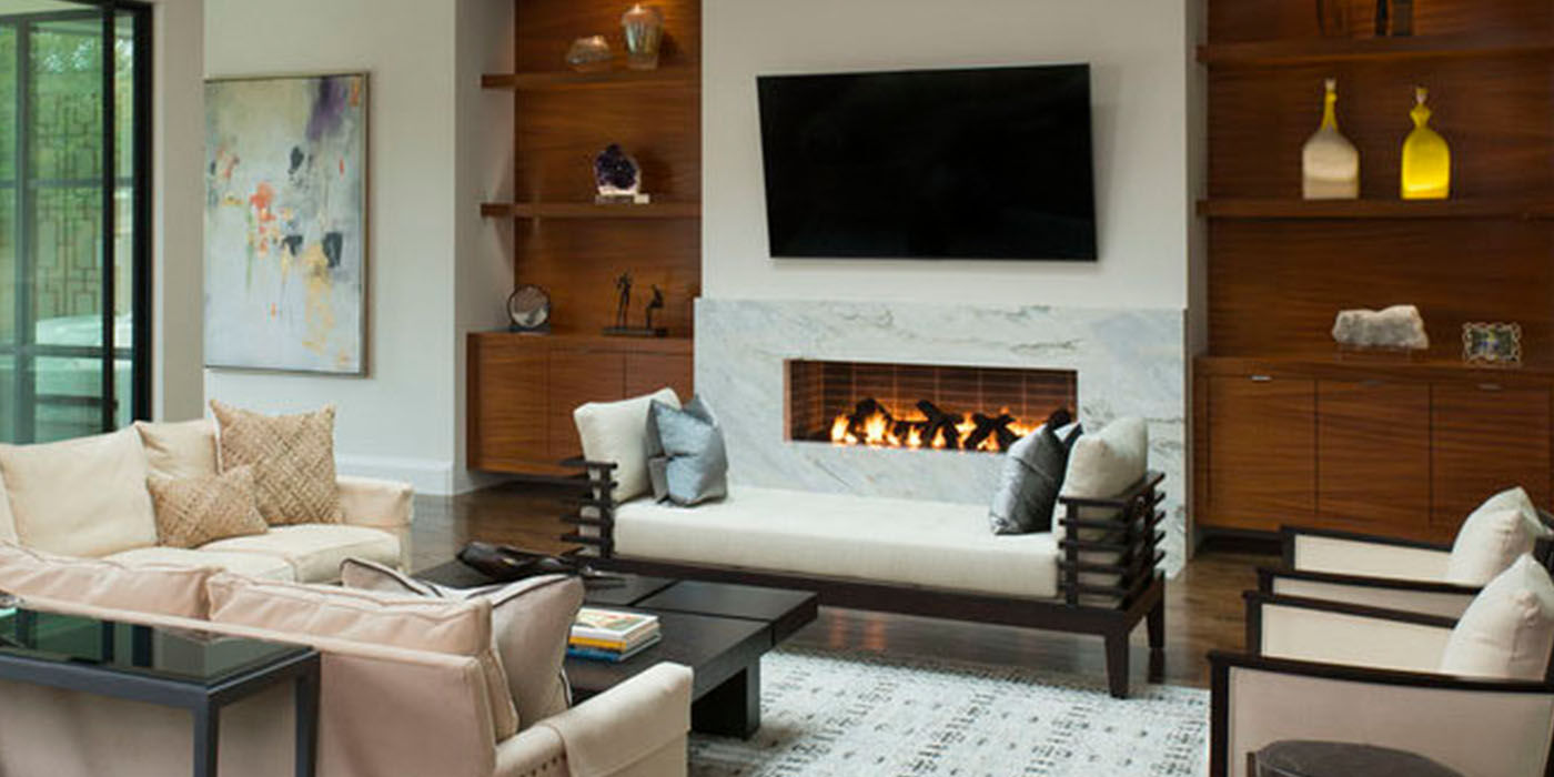 A modern indoor living room with a custom linear gas fireplace by Isokern