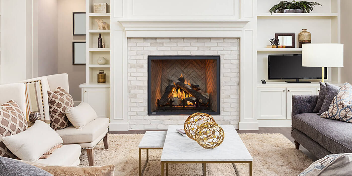 A transitional style home with a large, square-shaped gas fireplace and realistic gas log set