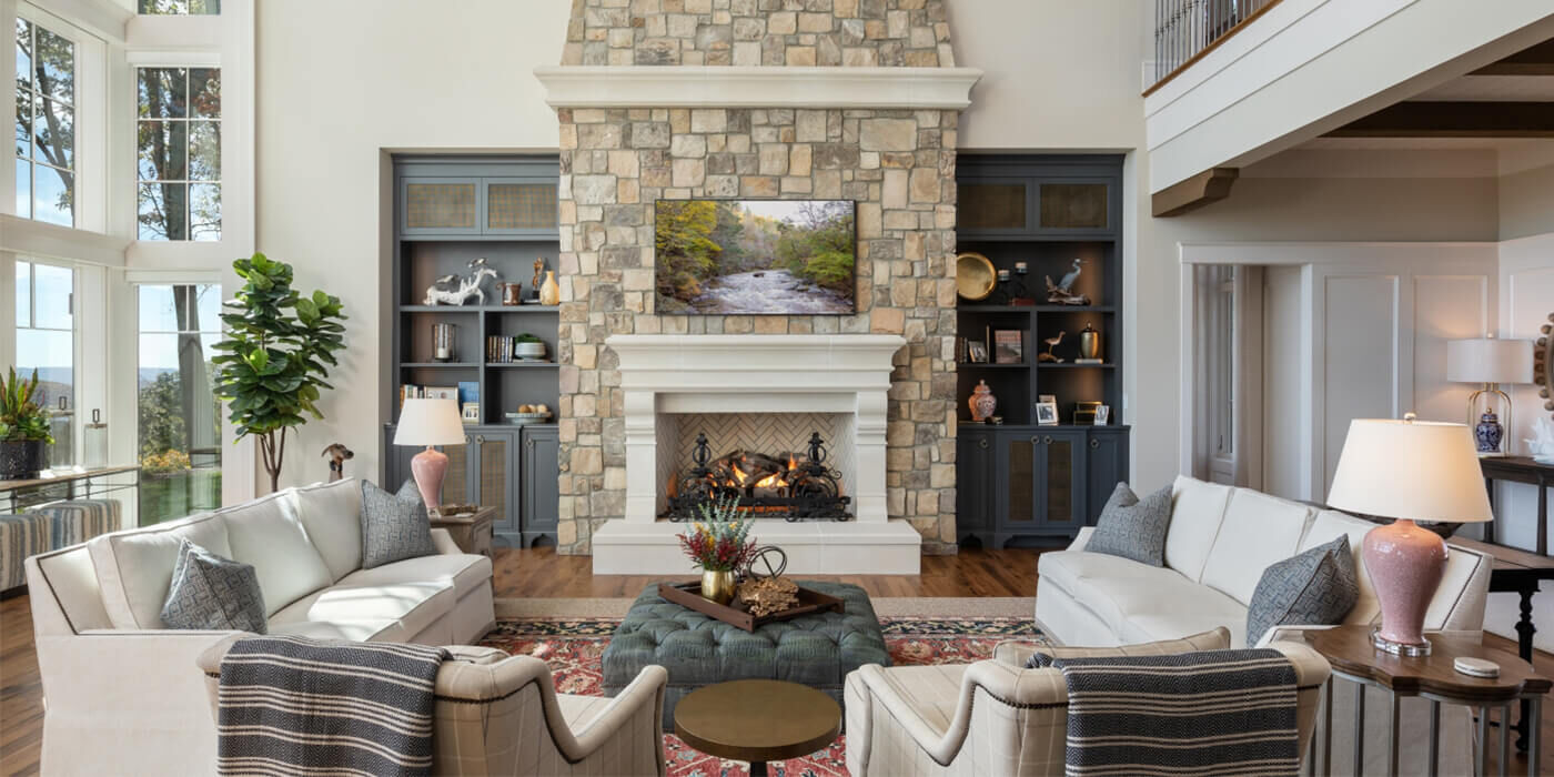 A contemporary living space with a traditional wood burning fireplace as the focal point