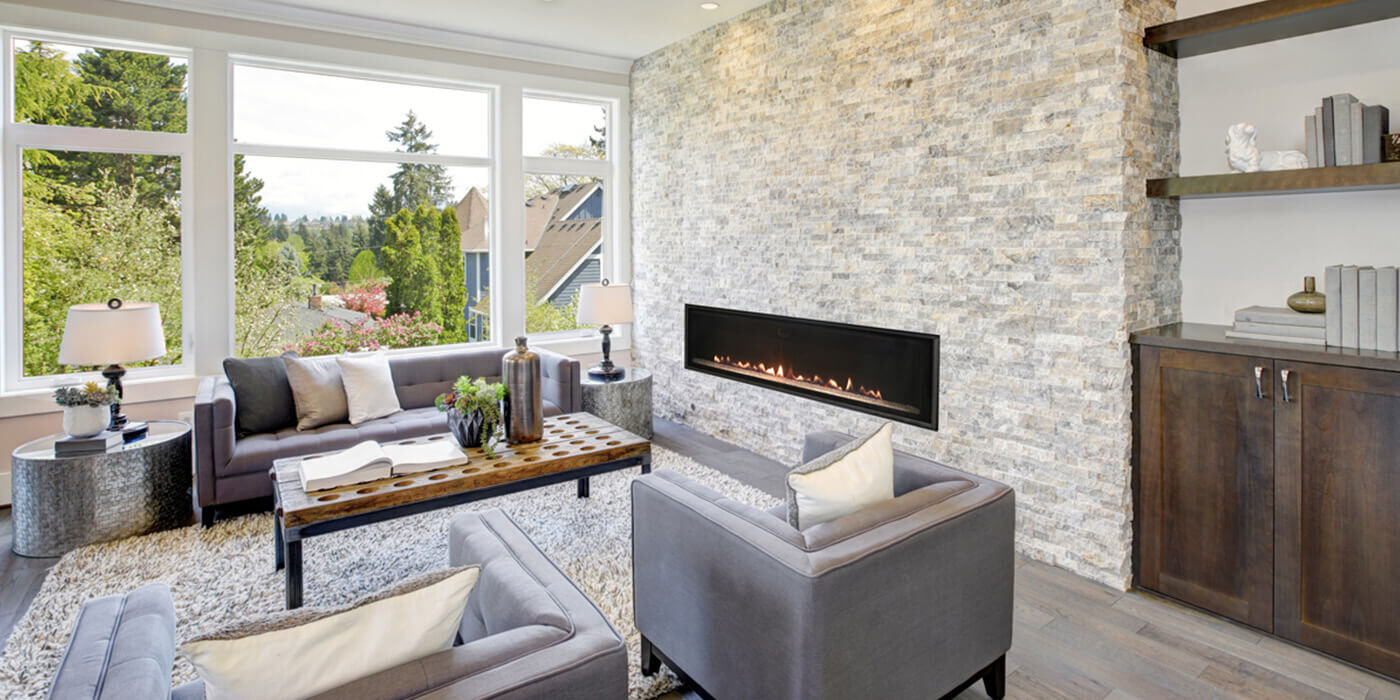 A modern living room with a large, linear Direct Vent gas fireplace