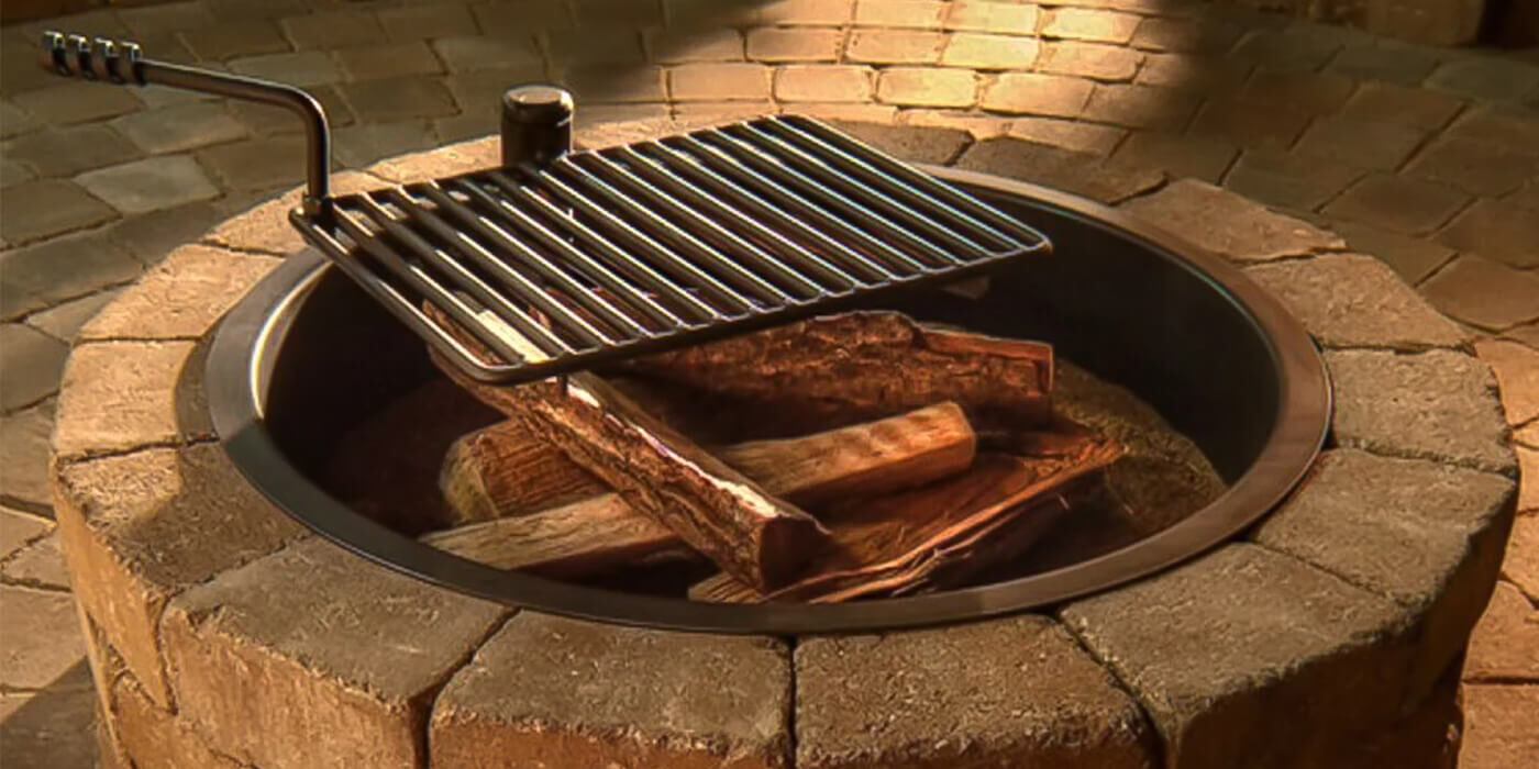 A custom-built wood burning fire pit with a fire ring and grate for outdoor cooking
