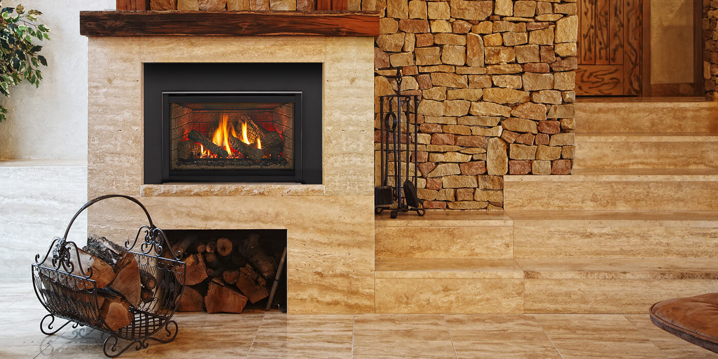 A traditional indoor space with a small wood burning fireplace insert and a stack of seasoned firewood on a small floor rack
