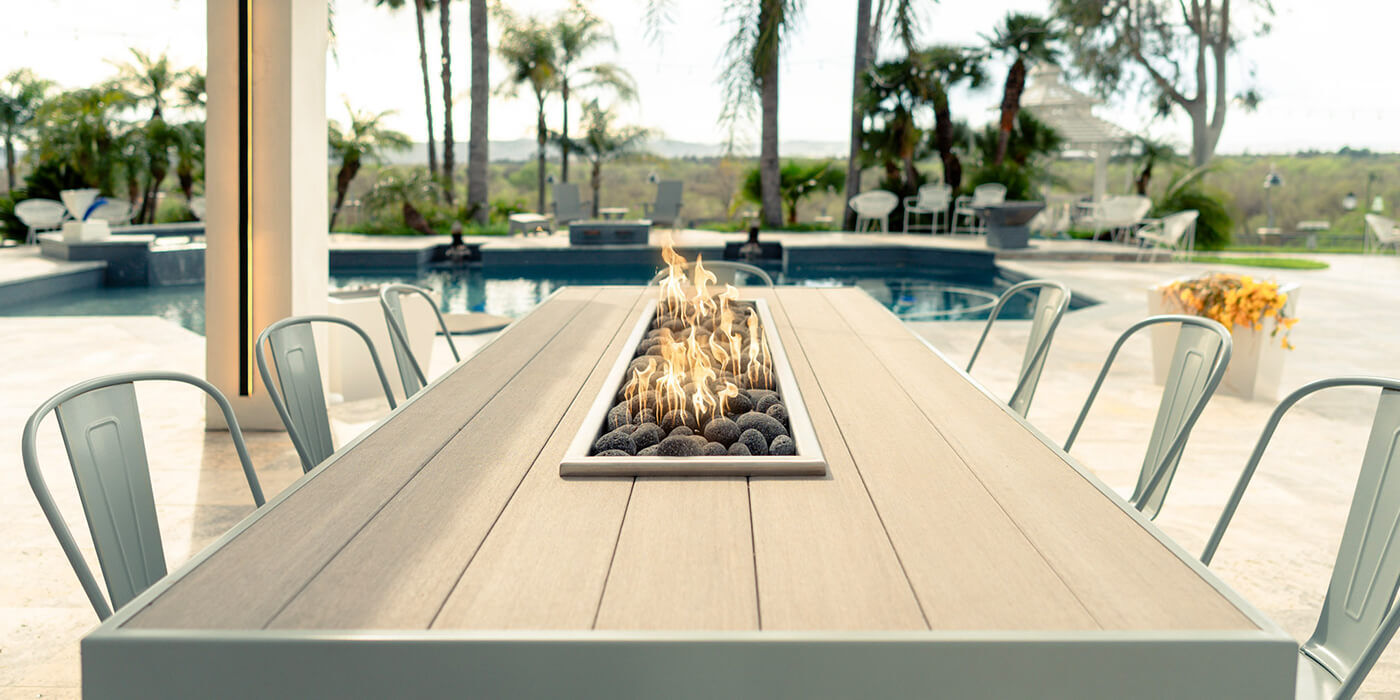 An outdoor fire pit dining table