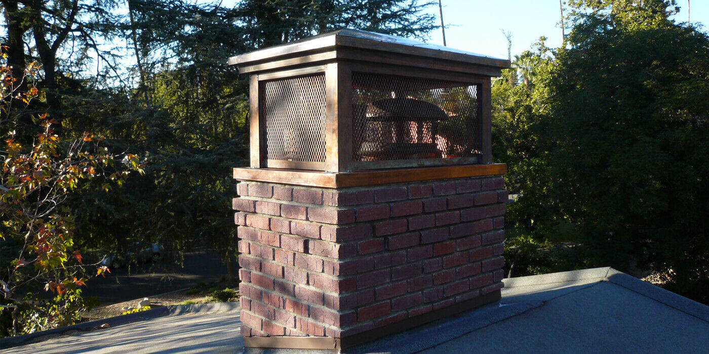 A custom chimney cap and shroud by the brand American Chimney Shroud