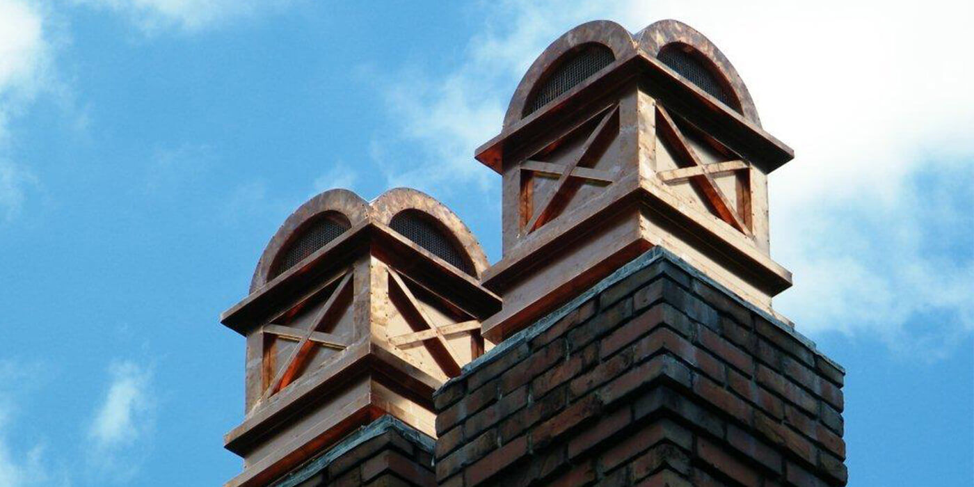 Two decorative copper chimney caps by American Chimney Shroud