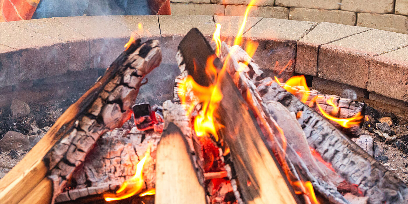 Close up of a wood fire pit burning 