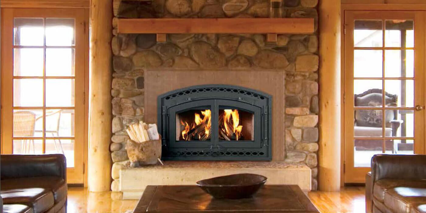 A rustic living space with a traditional gas fireplace and a heavy-duty, industrial-style door