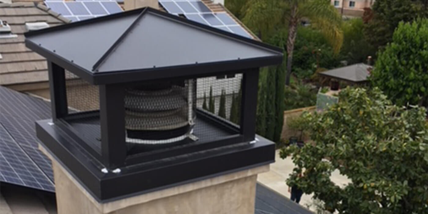 A black Kynar-coated steel chimney cap and shroud