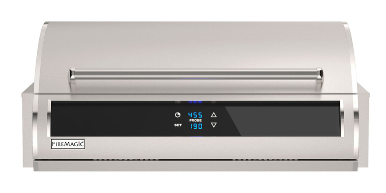 A front view of a Fire Magic grill hood and digital control panel showing blue temperature readings against a white background.