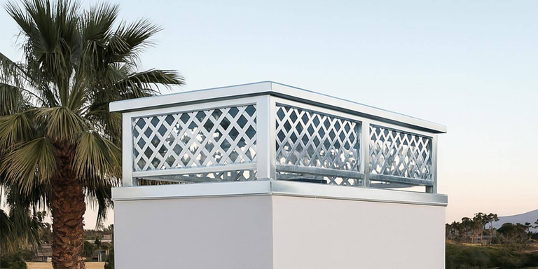 A decorative stainless steel chimney cap from American Chimney Shroud
